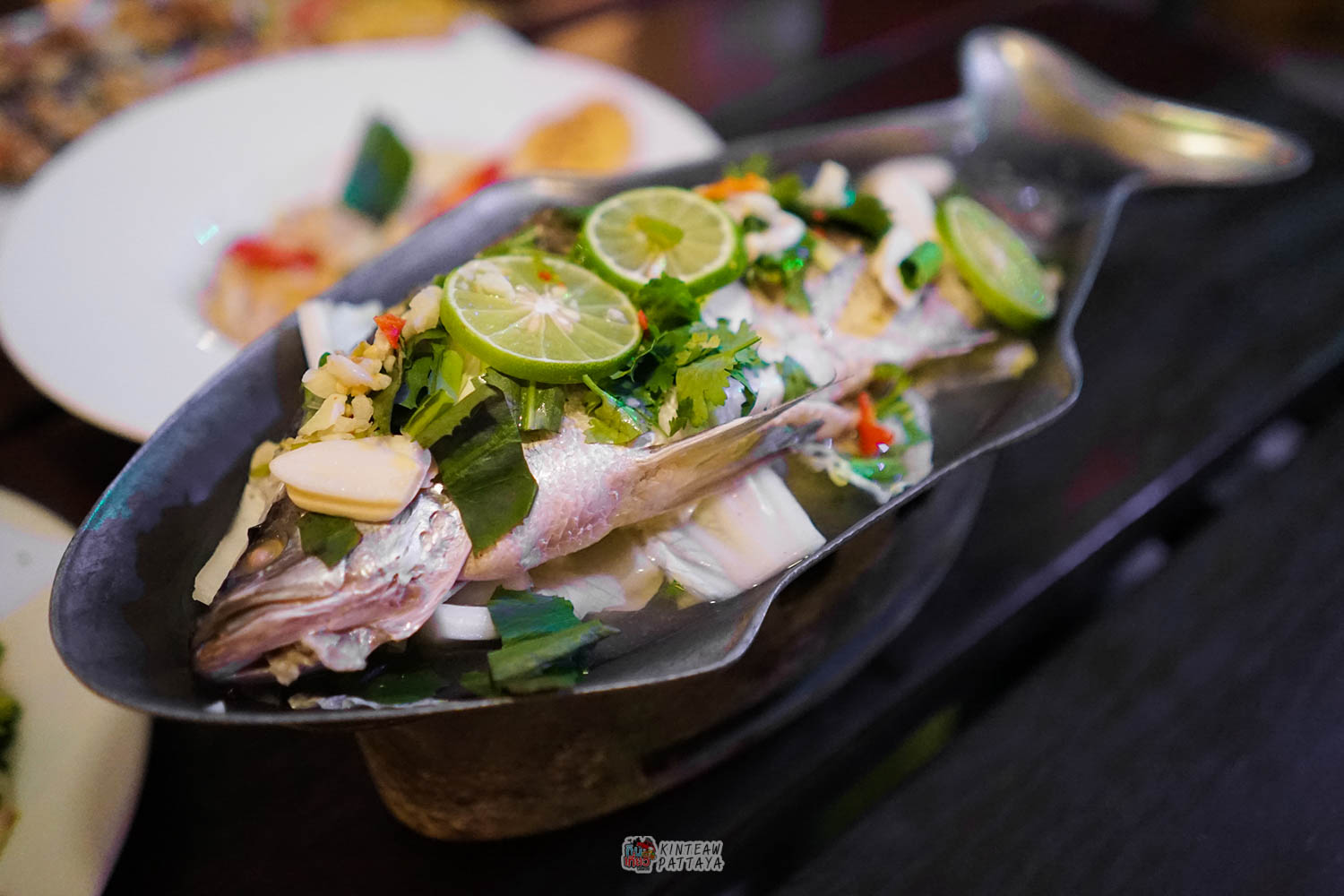 Steamed whole fish with lime and herbs